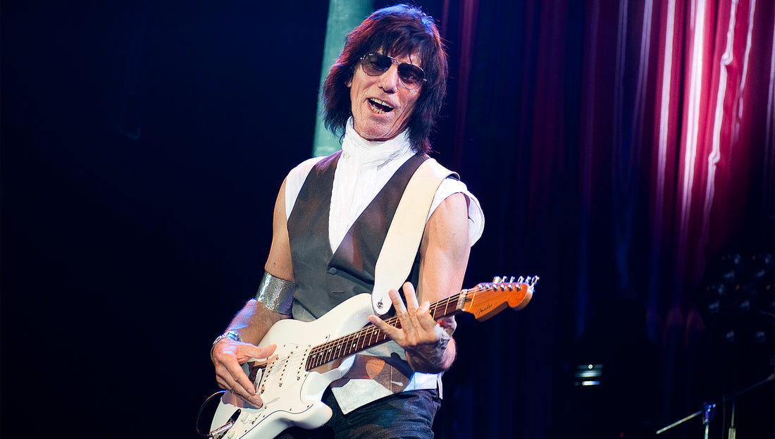 Jeff Beck playing electric guitar with his expressive, vocal-like style
