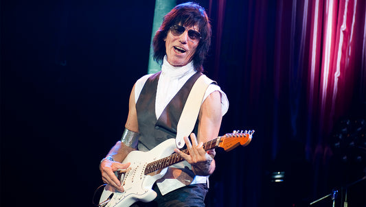 Jeff Beck playing electric guitar with his expressive, vocal-like style
